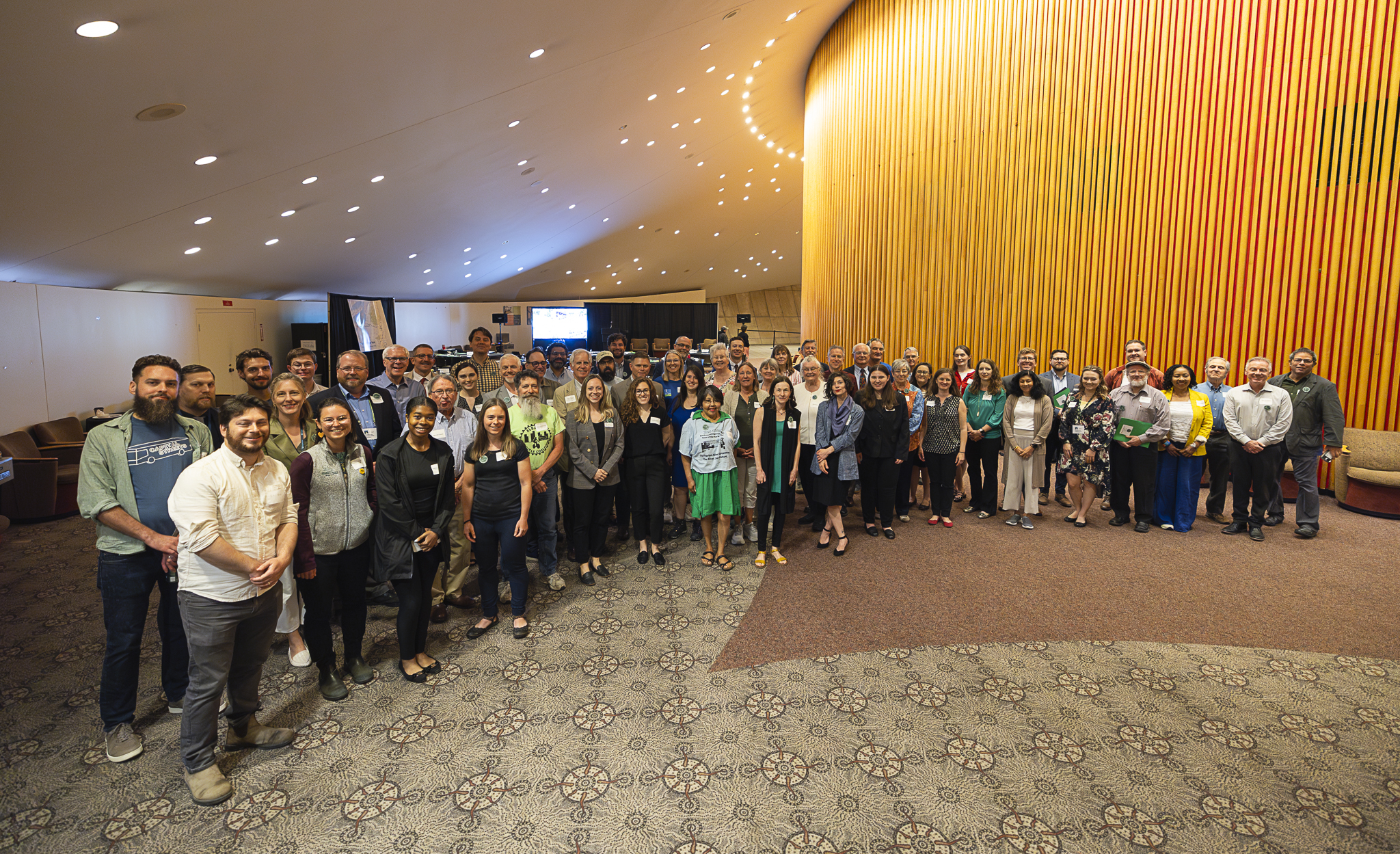 A large group of advocates stand together.