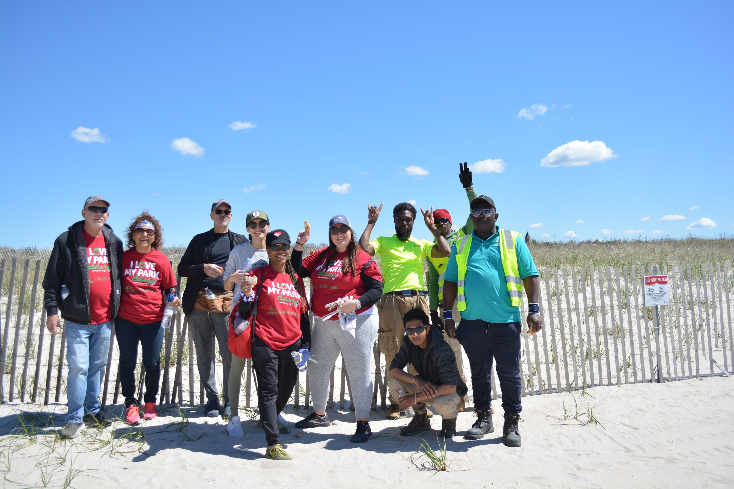 A group of volunteers pose for a photo at Jones Beach.