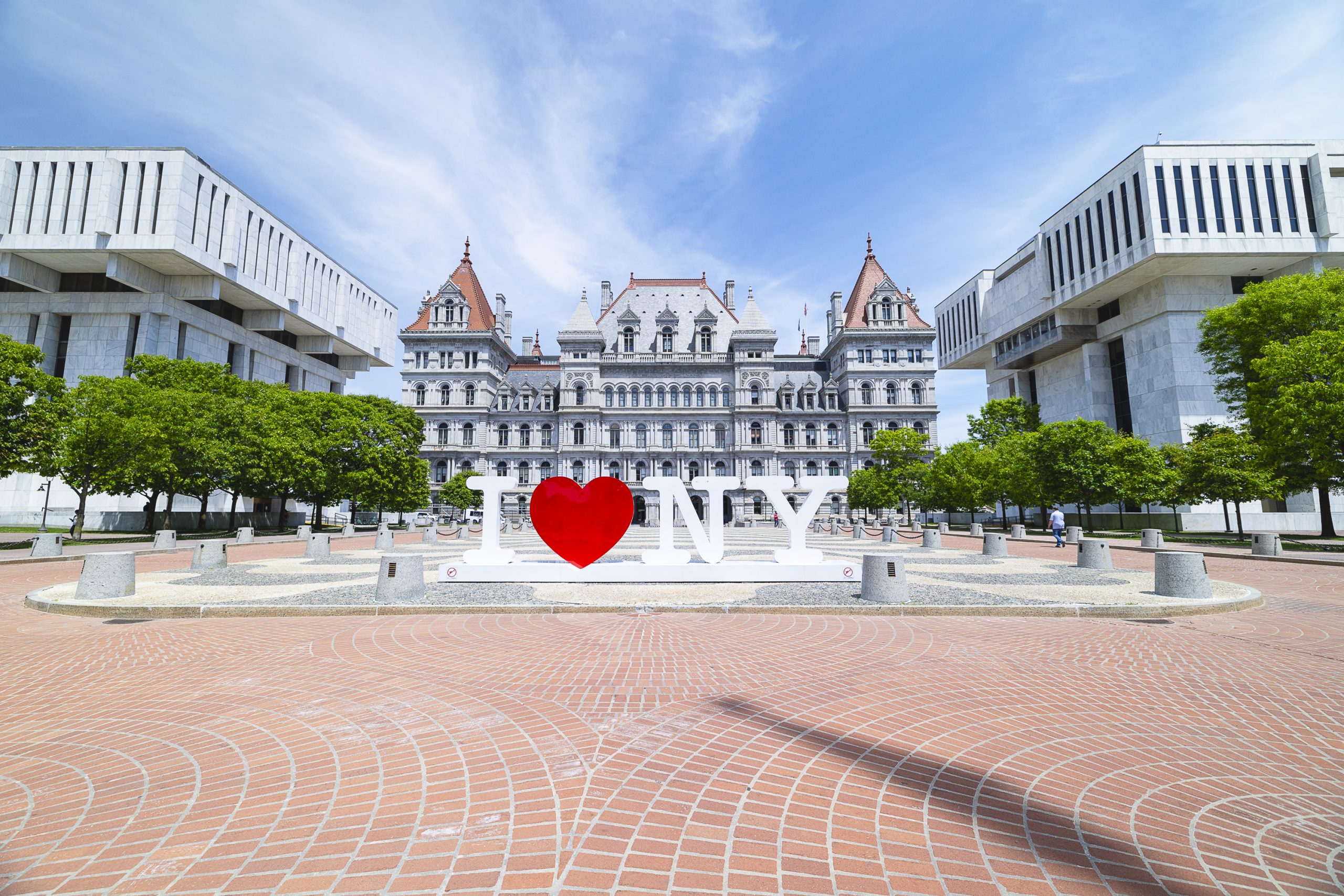 The I Love NY Sign in front of the State Capitol building.