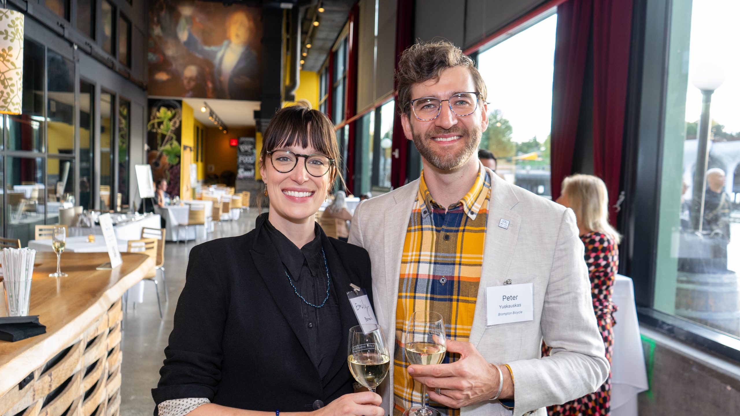 Two event-goers pose for a photo.