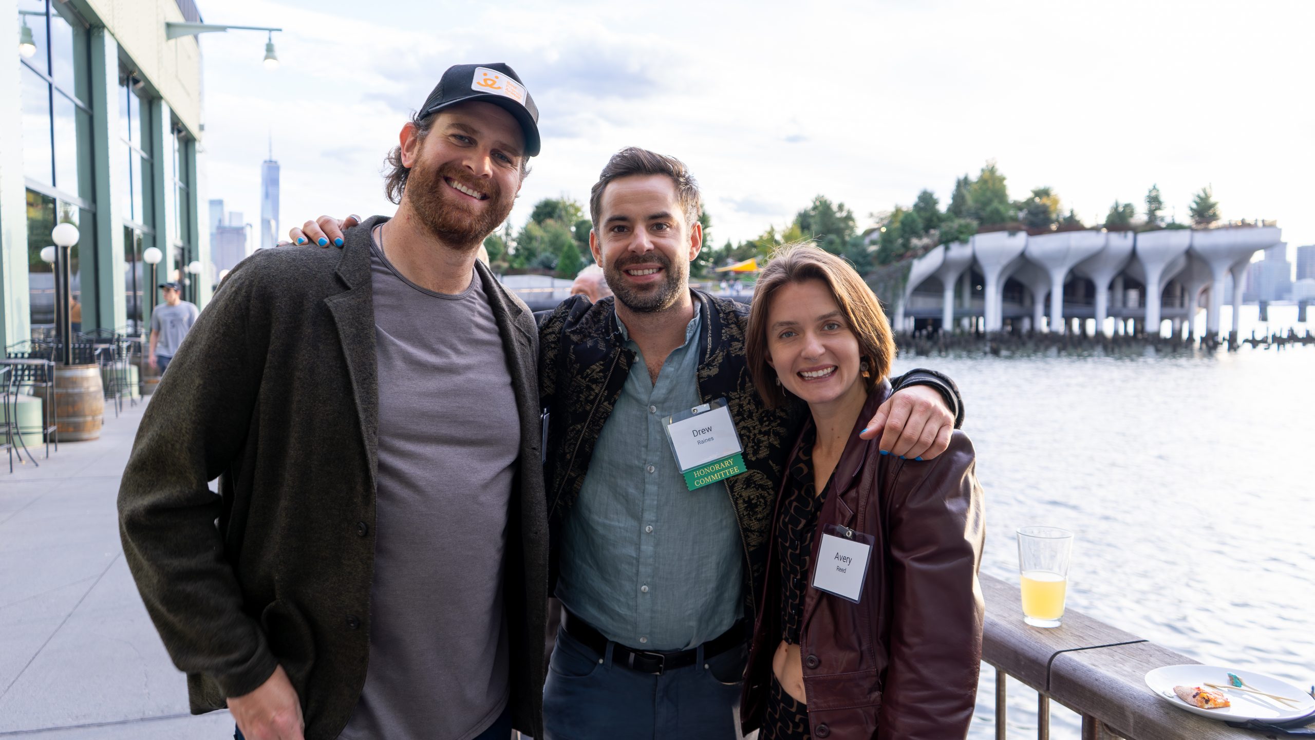 Three event-goers pose for a photo.