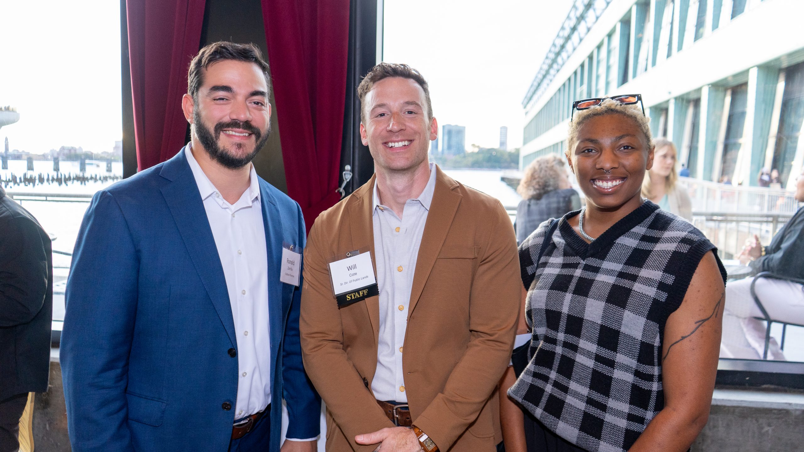 Three event-goers pose for a photo at the George W. Perkins Reception.