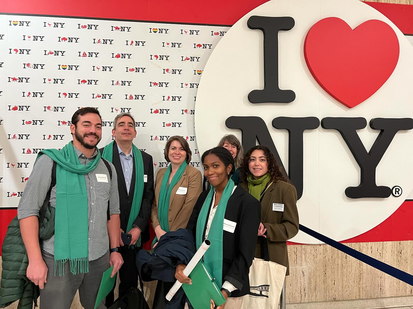 Advocacy group in front of I Love NY sign