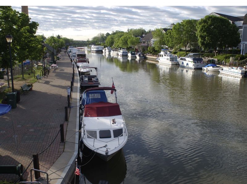 A cyclist rides past a handmade sign with a heart and the word cyclists.