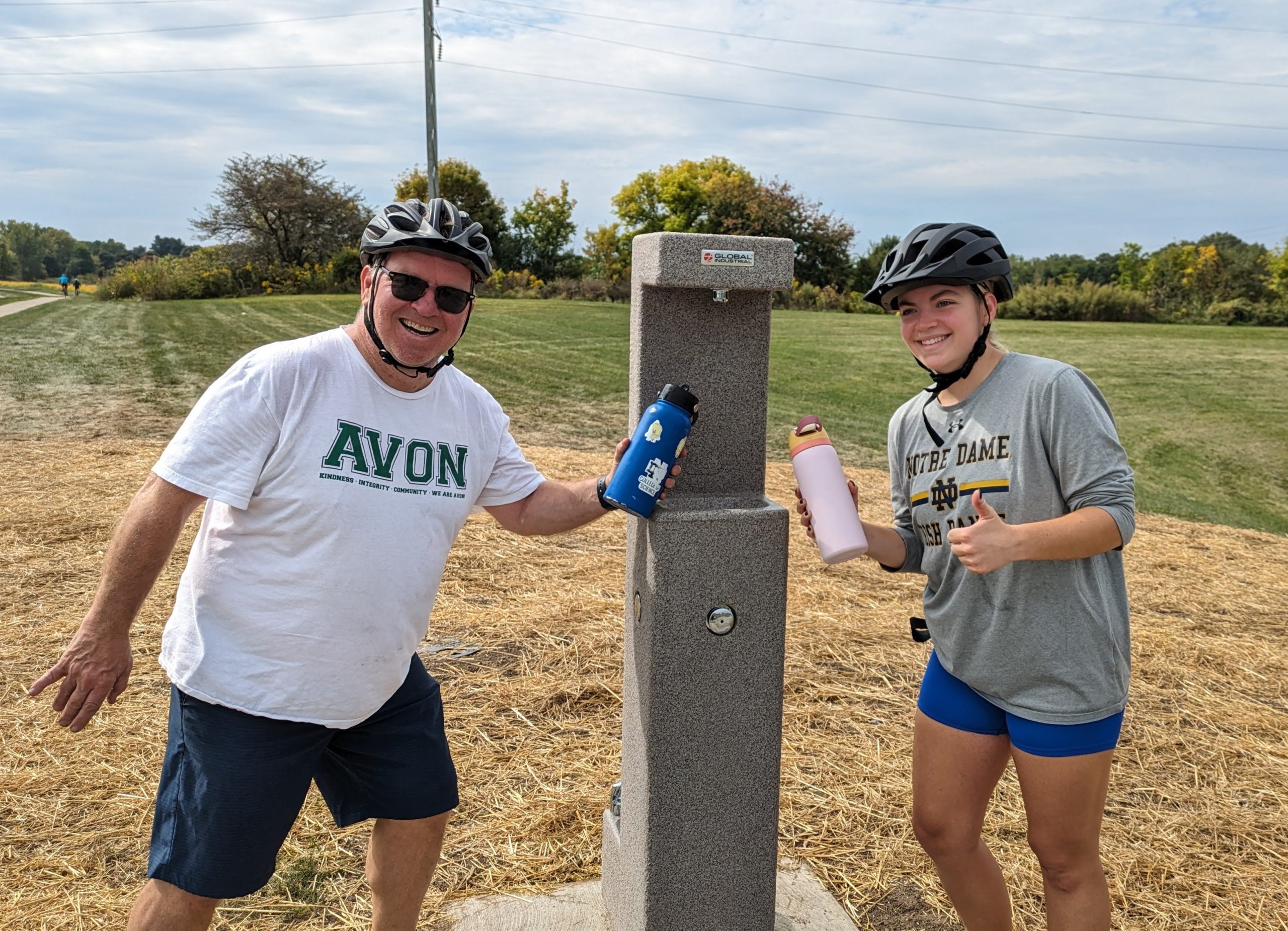 Cyclists at water station in Avon, NY